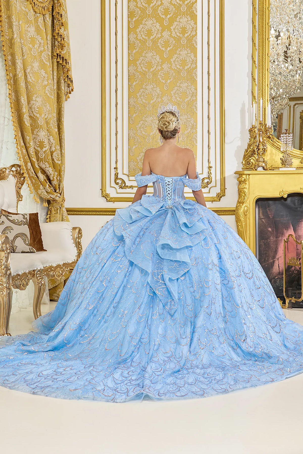 Front view of a Bahama Blue quinceañera gown with off-the-shoulder neckline, sheer corset bodice, scalloped sequin embroidery, and glitter tulle skirt