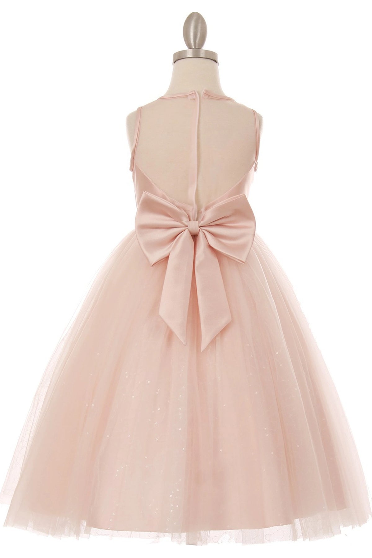 Finished details of a sheer back panel and satin bow distinguish the Pink kids party dress.