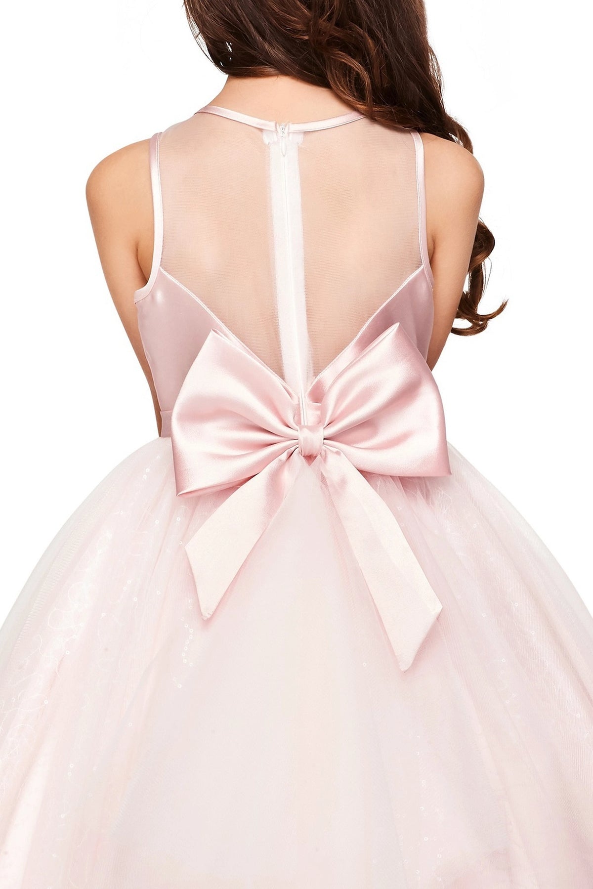Detailed by a sheer back panel and satin bow, the Pink kids party dress reveals its construction.