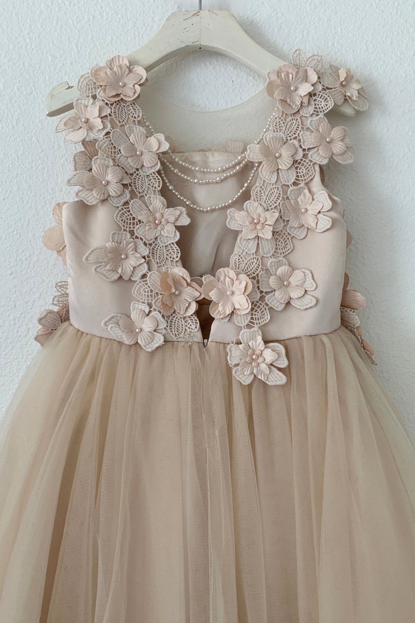 Beige flower girl dress with floral lace top.