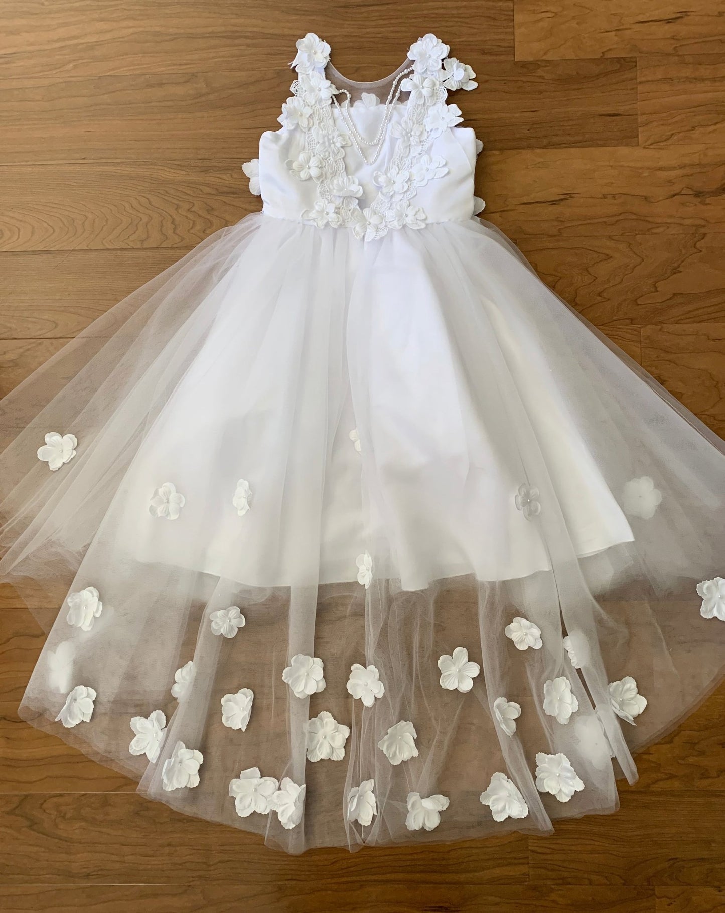 Front view of White High-Low Tulle flower girl dress with 3D Flower Lace Top Accentuated with Pearl Trim Dress.