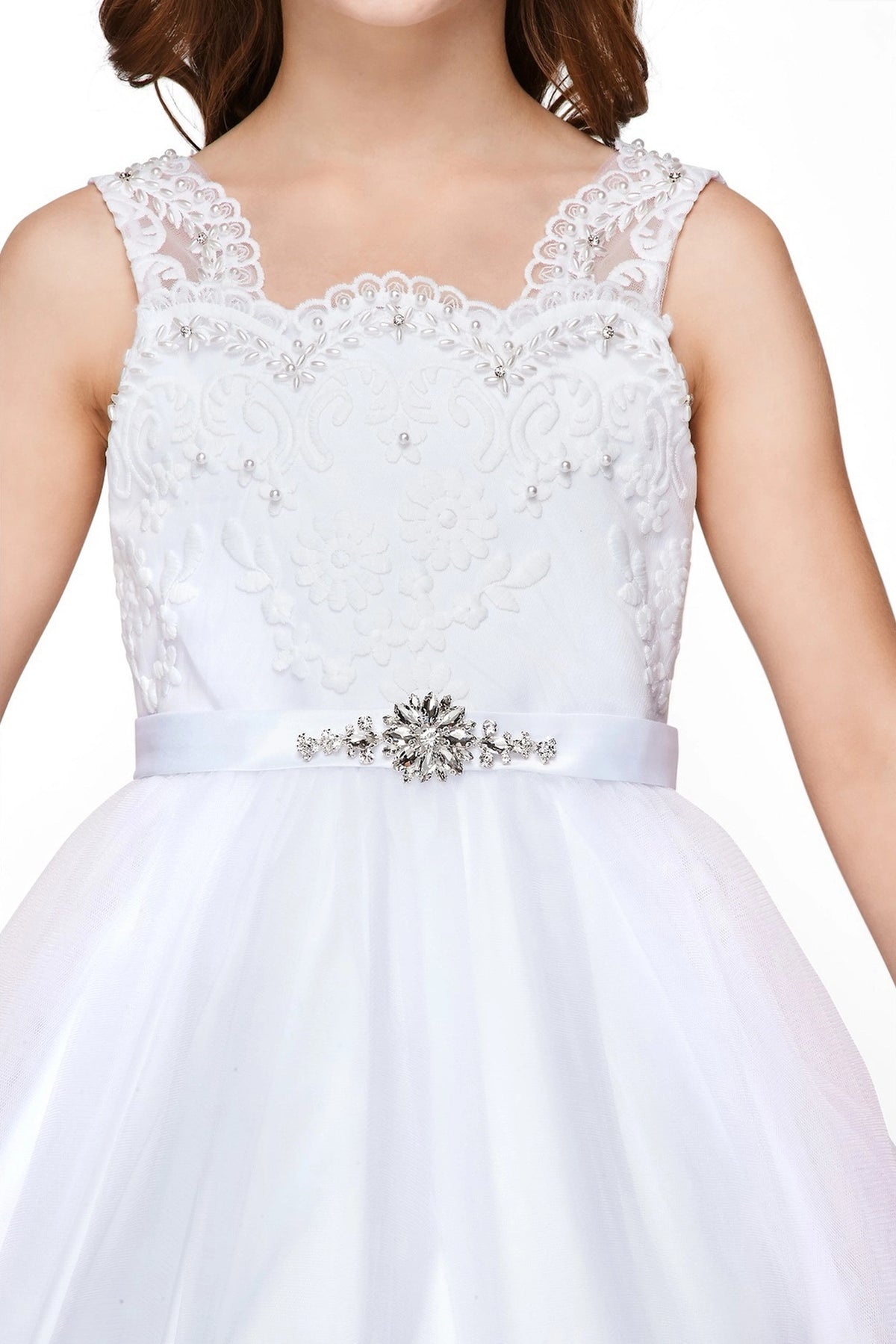 Detailed by scalloped floral lace on the bodice, the White kids party dress reveals its construction.