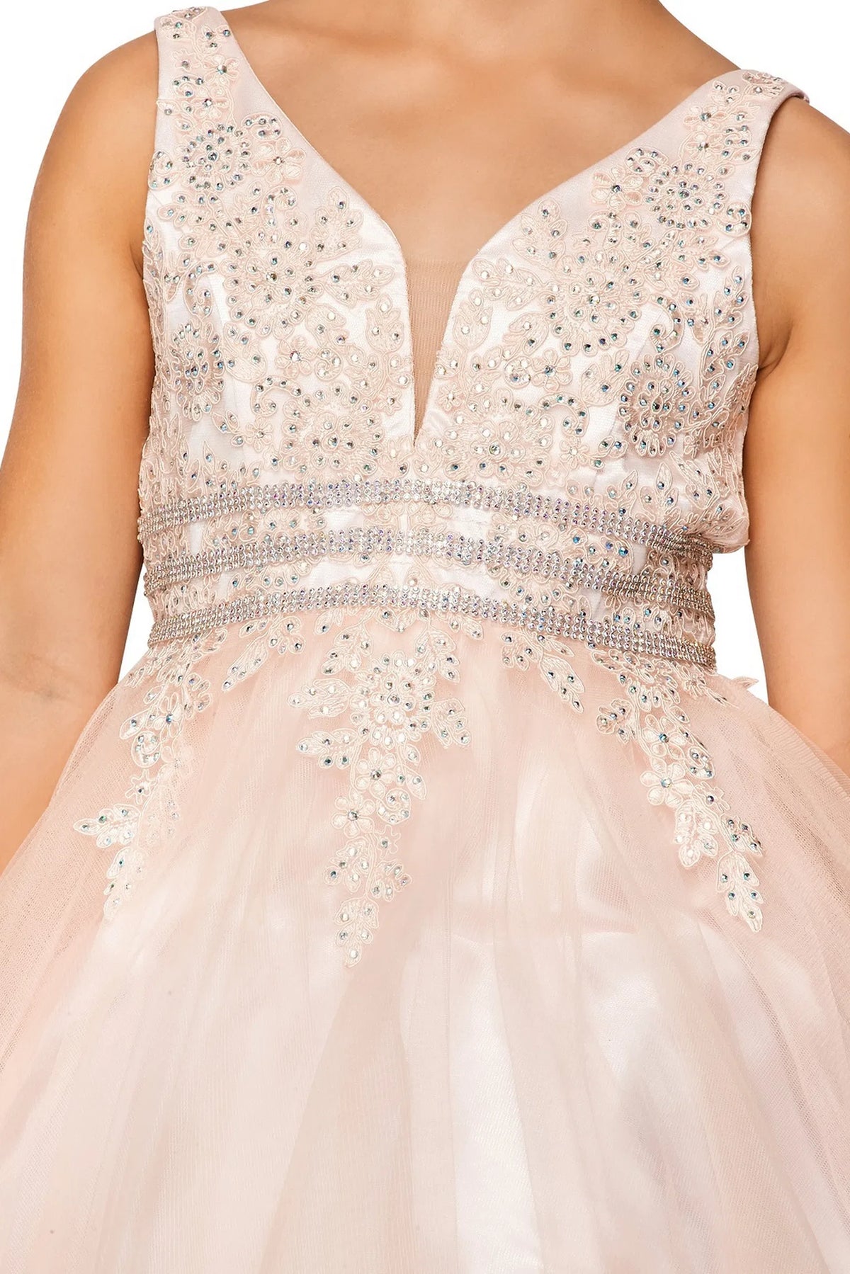 Detailed by beadwork framing the V-neckline, the Dusty Pink kids party dress reveals its construction.