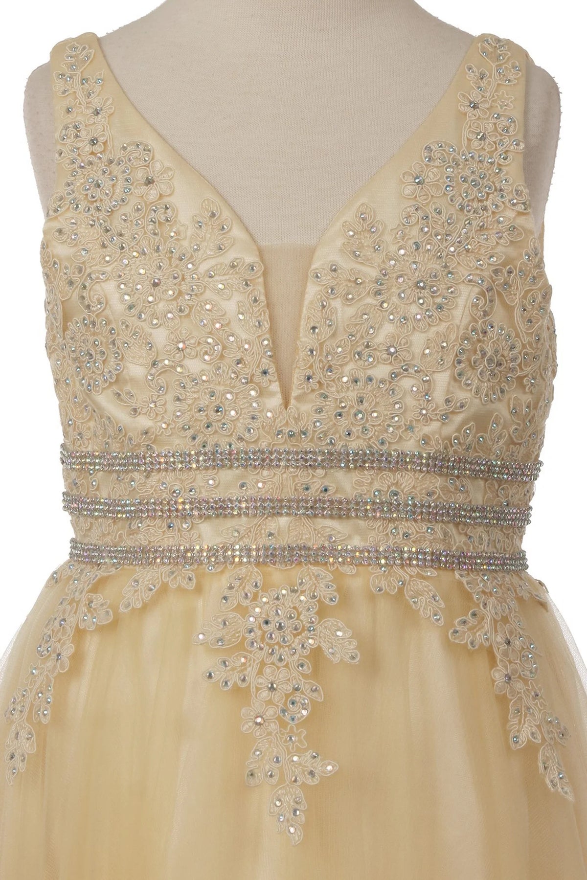 Detailed by beaded lace on the V-neck bodice, the Champagne kids party dress reveals its construction.