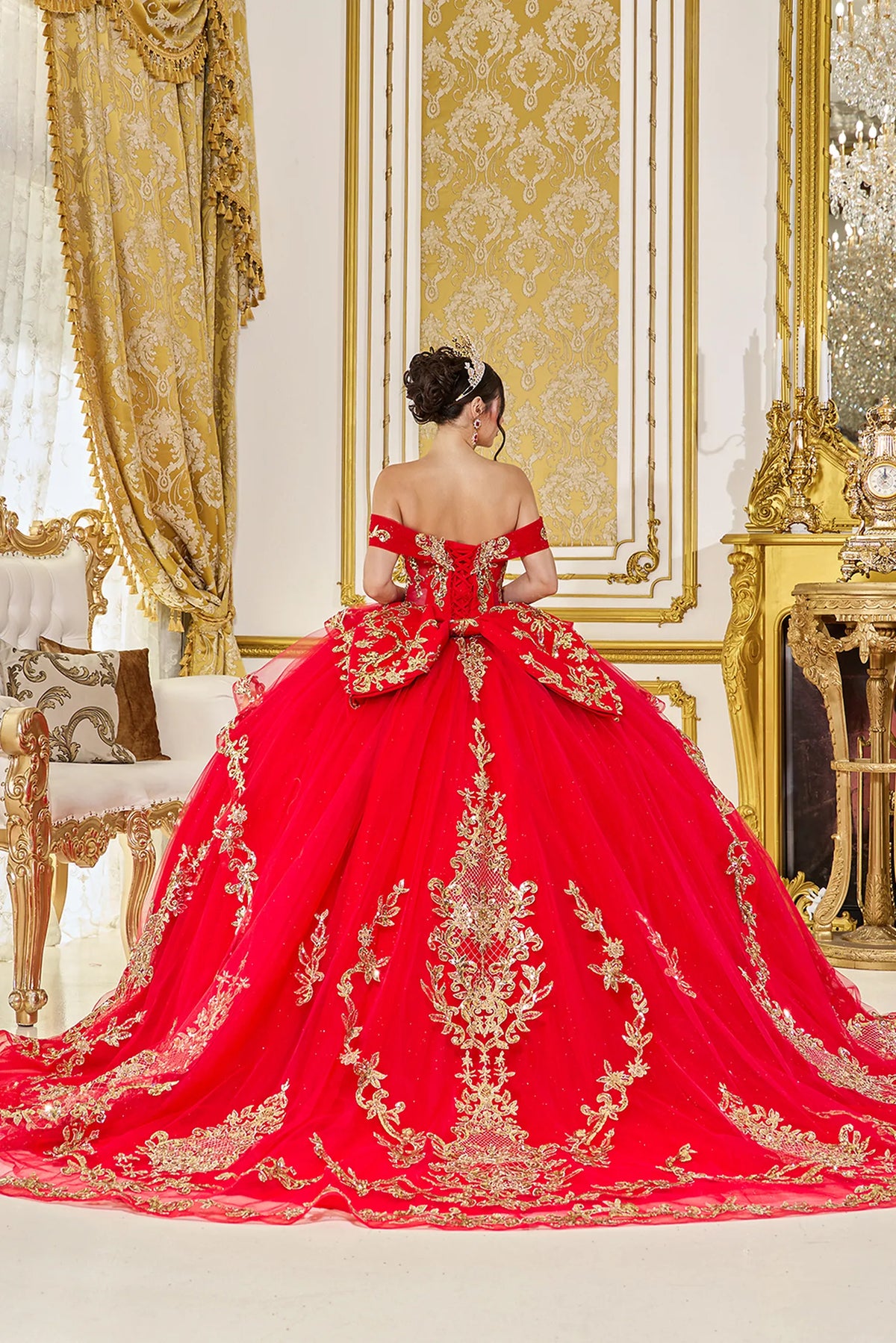 Back view of a Red quinceañera gown showing lace-up back and embroidered lace