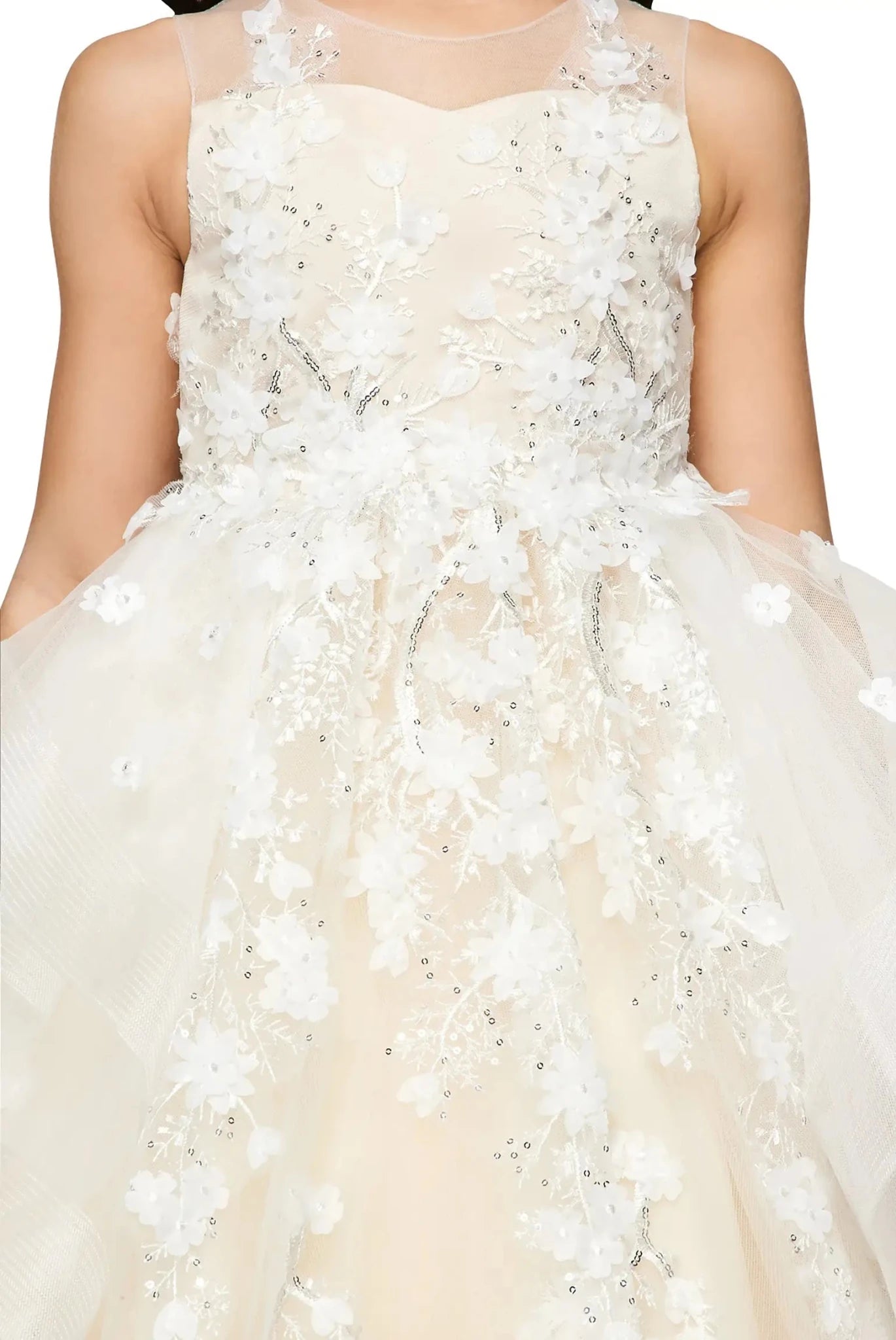 Close-up front-facing view of champagne high-low flower girl dress.
