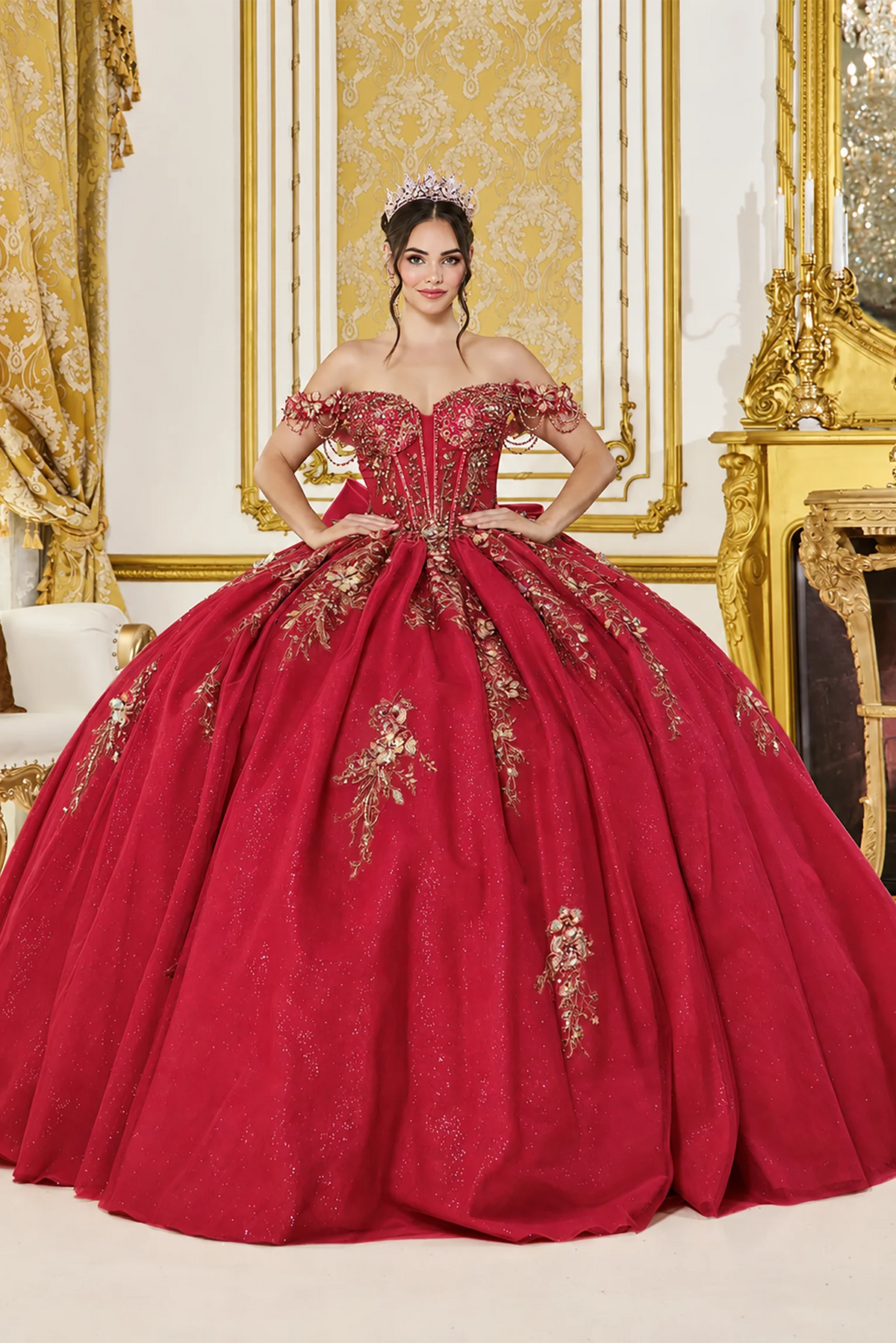 Showing beaded fringe at its neckline and embroidered skirt accents, this Burgundy quinceañera ball gown is shown in full view.