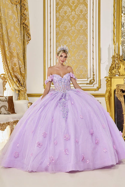 Woman in a lilac quinceanera ball gown standing in an ornate room with gold decorations.