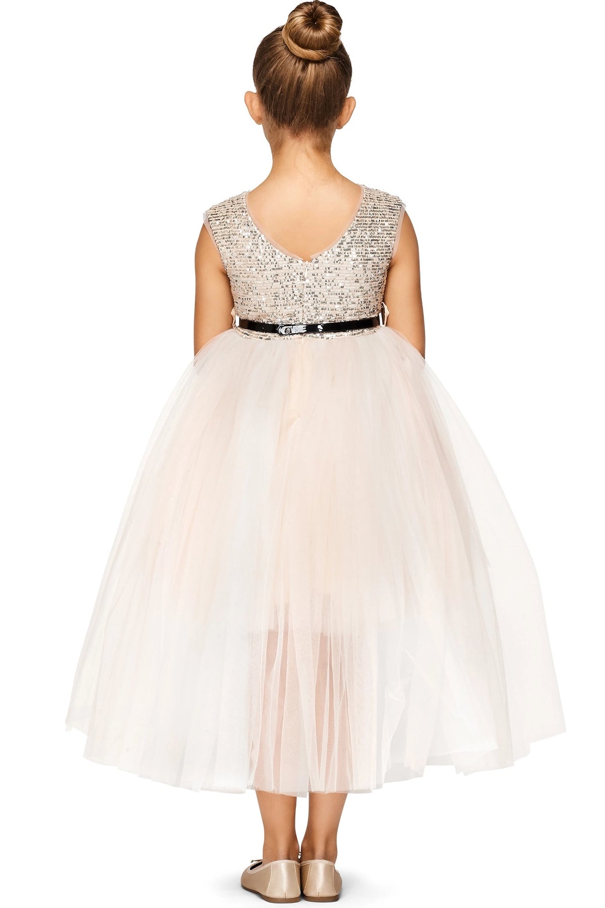 A Champagne flower girl dress showing V-shaped back and high-low tulle skirt.