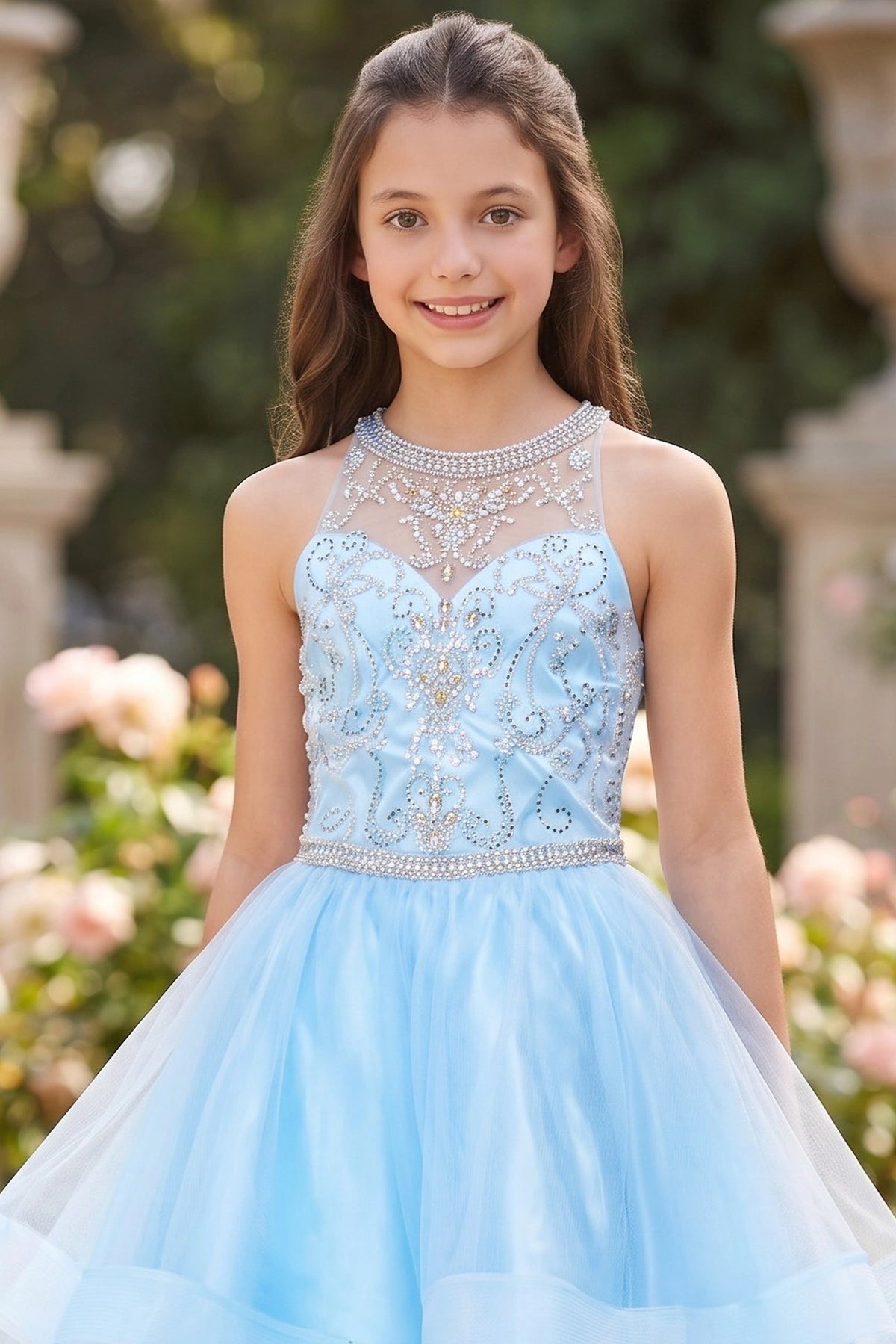 Accented a tiered high-low tulle skirt adds character to this Blue kids party dress.