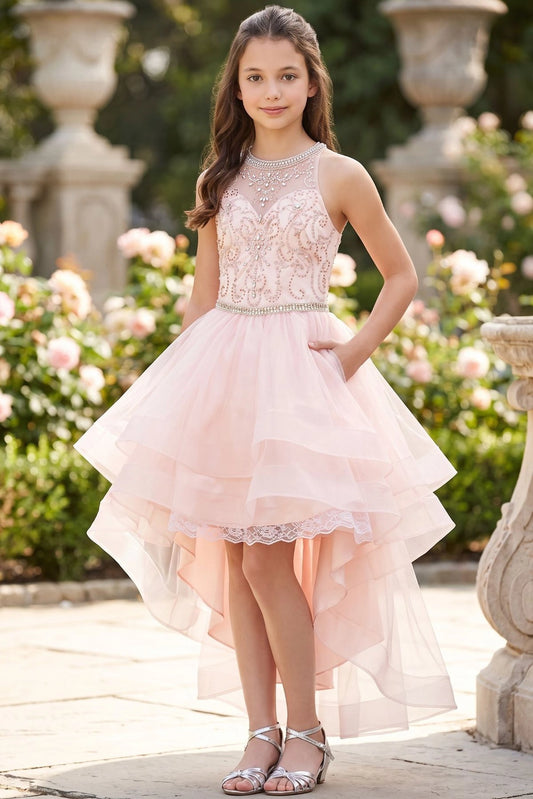 Accented a tiered high-low tulle skirt adds character to this Blush kids party dress.