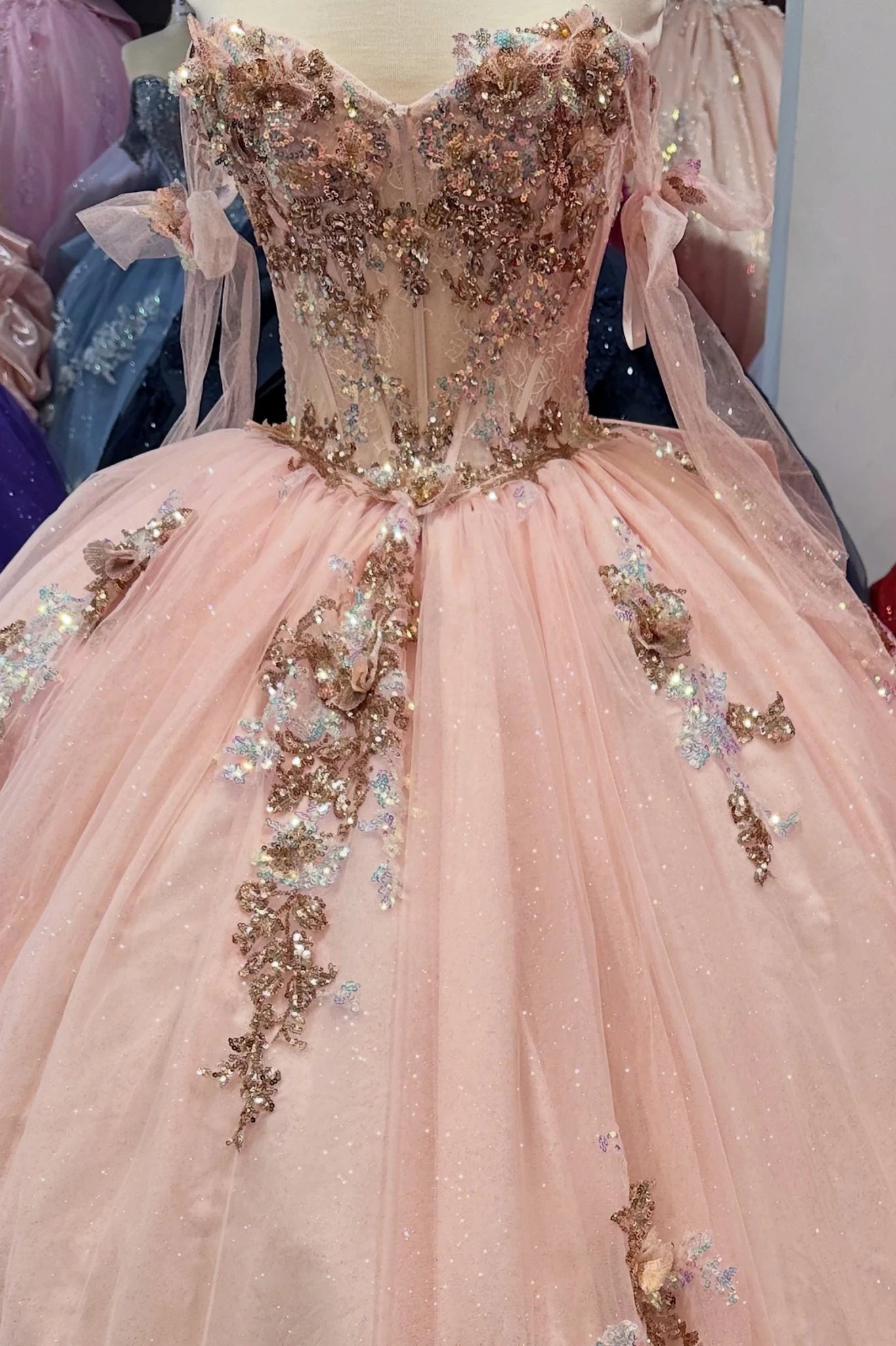 Blush quinceanera dress with floral beaded sweetheart corset and ribbon shoulder straps