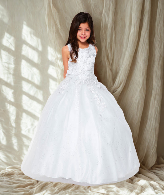 Young girl in a white floral dress standing against a neutral background