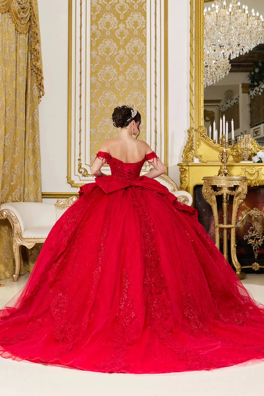 Back view of red quinceañera ball gown featuring lace-up corset back, oversized bow accent, and full glitter tulle skirt with embroidered lace details.