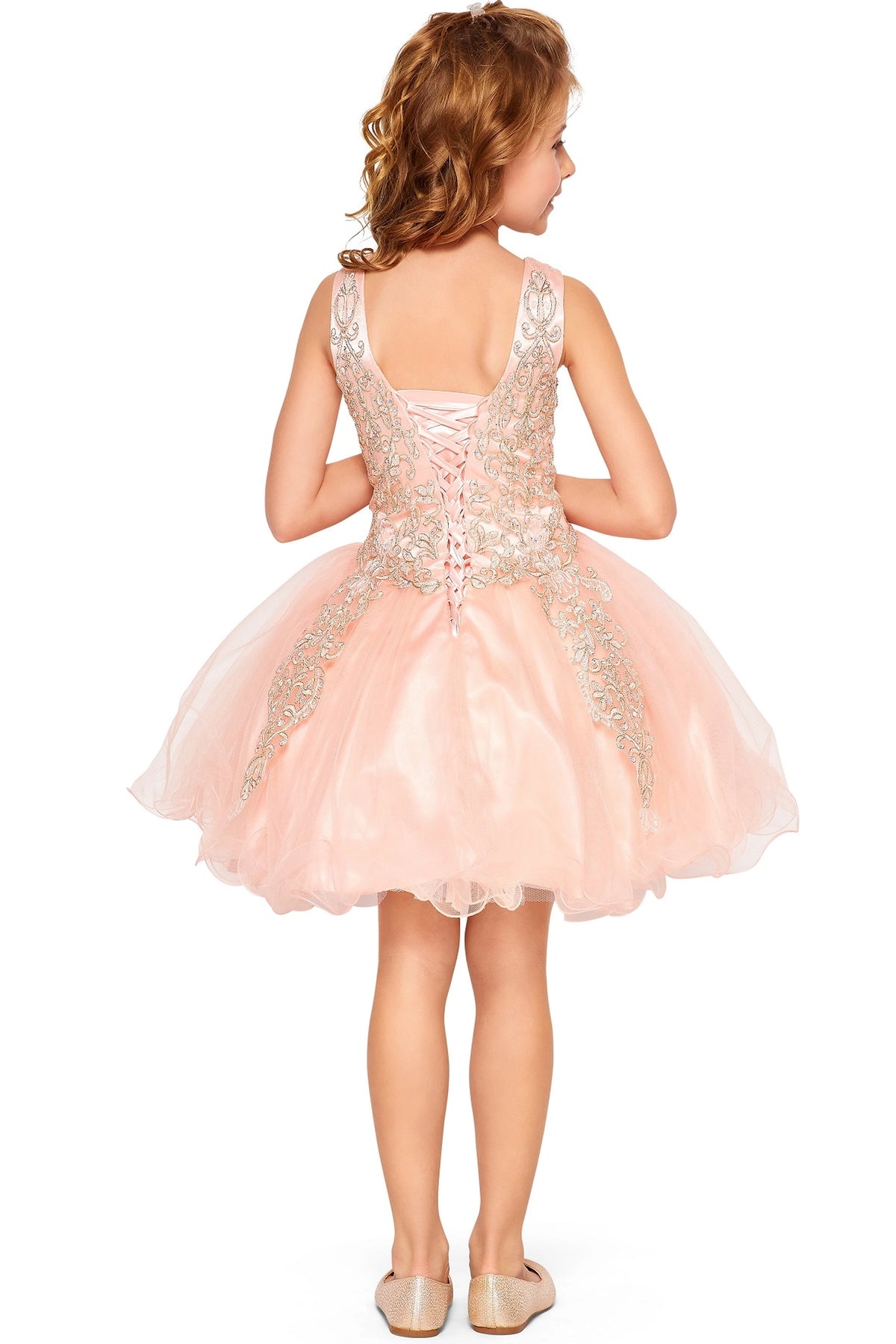 Finished details of a V-shaped back with ornamental lace distinguish the Blush kids party dress.