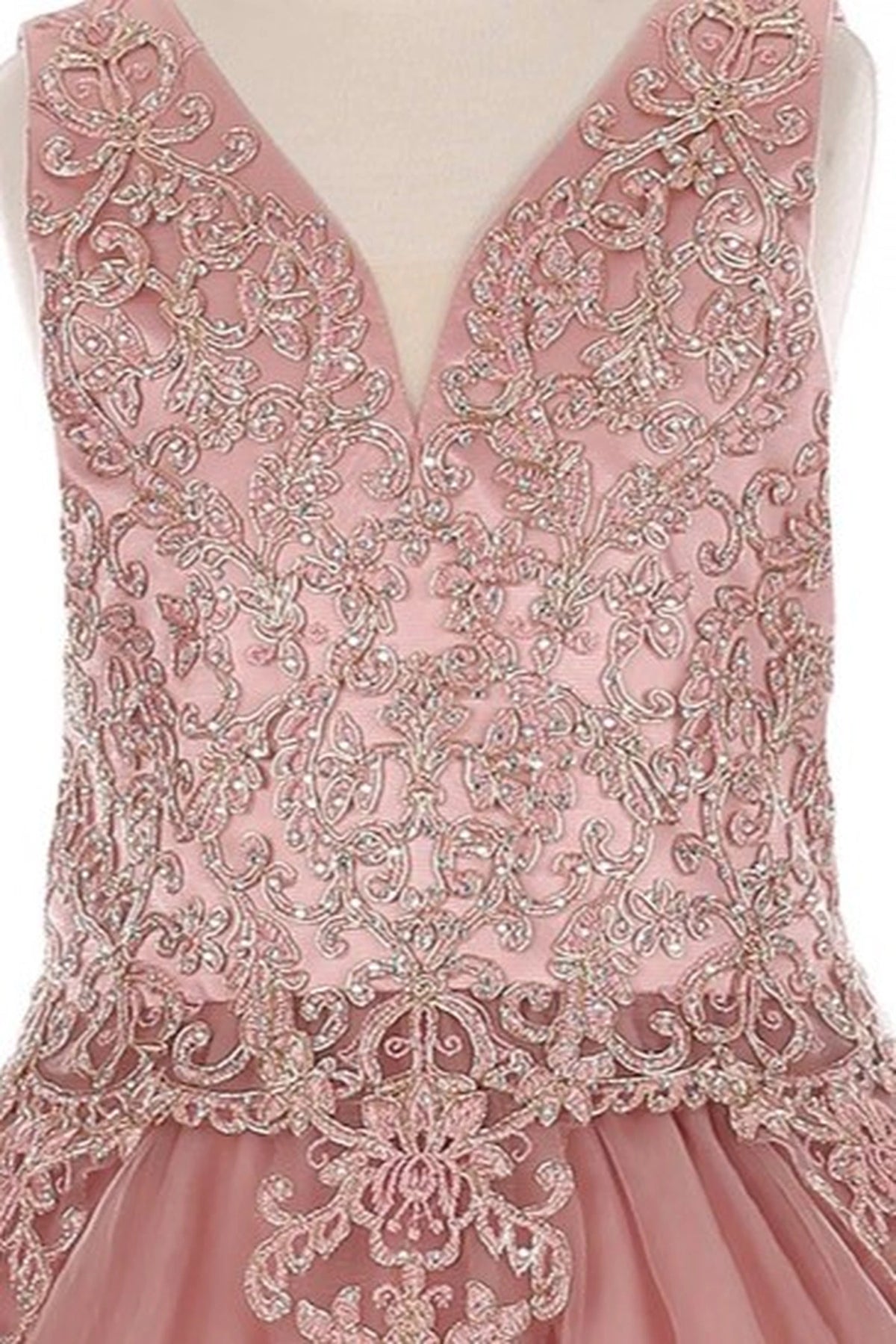 Finished details of contrasting ornamental lace on the bodice distinguish the Dusty Rose kids party dress.