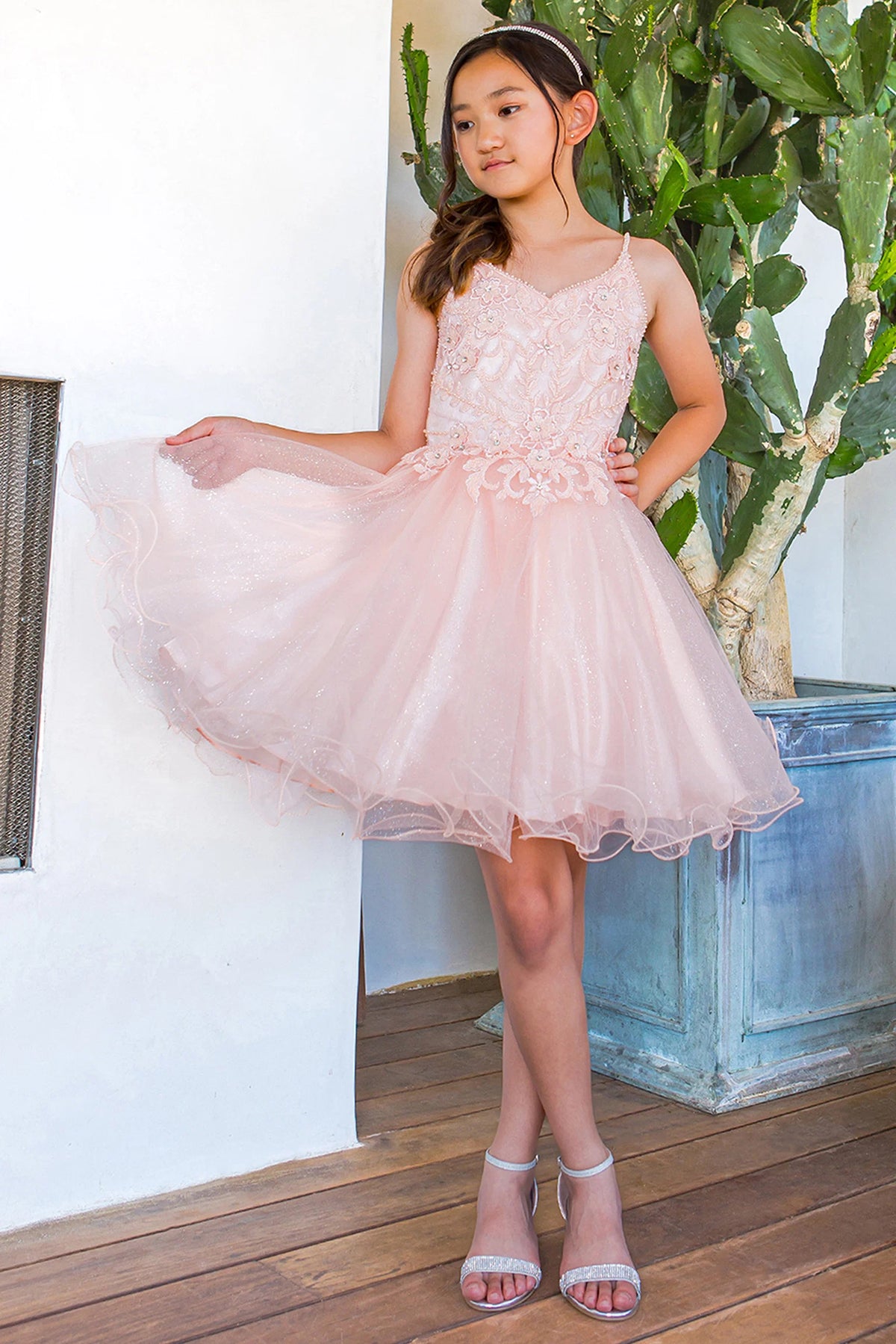 Featuring with a flared tulle skirt, this Blush kids party dress displays elegant detail.