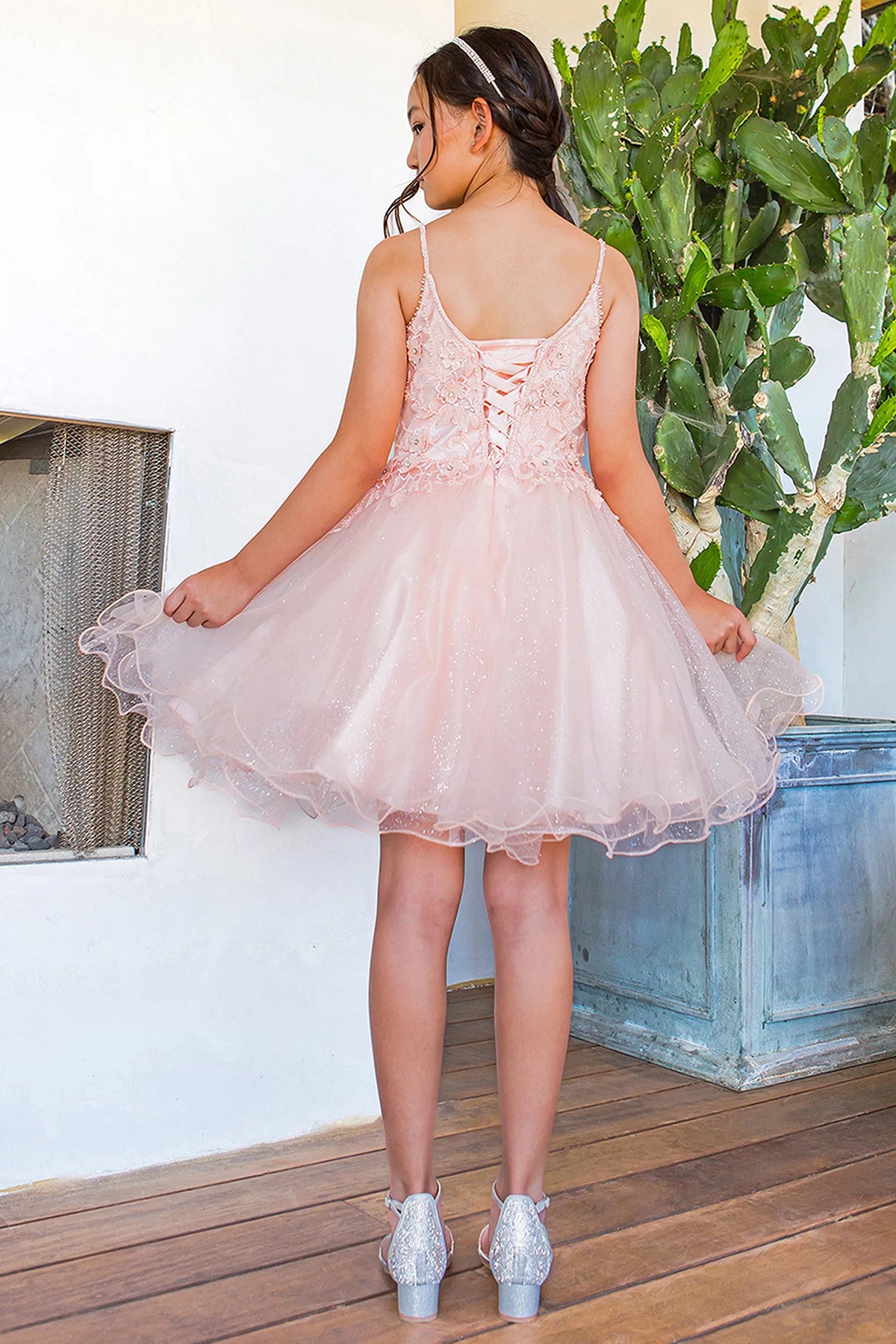 Finished details of crisscross back lacing distinguish the Blush kids party dress.