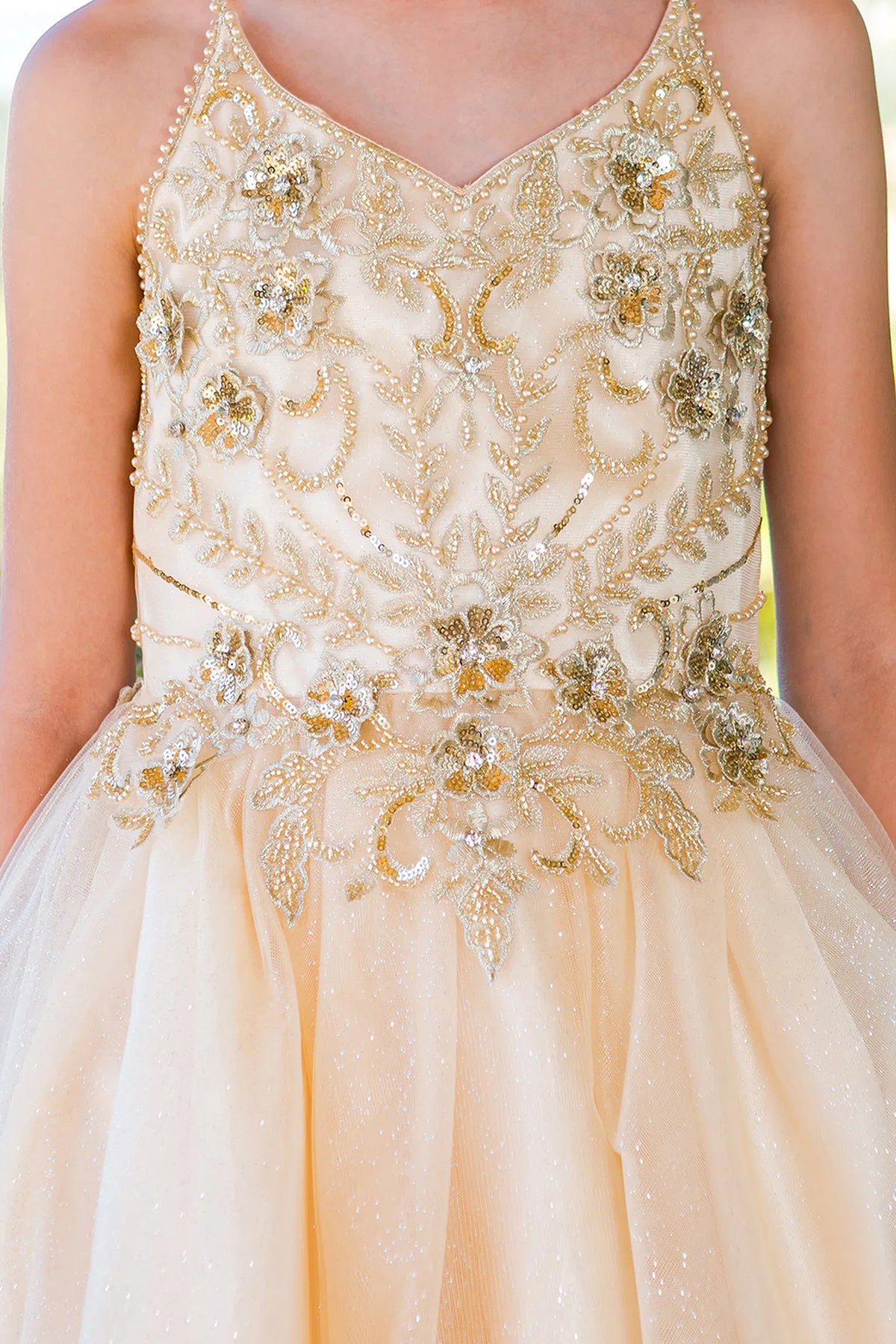 Featuring with floral beadwork across the bodice, this Champagne kids party dress displays elegant detail.