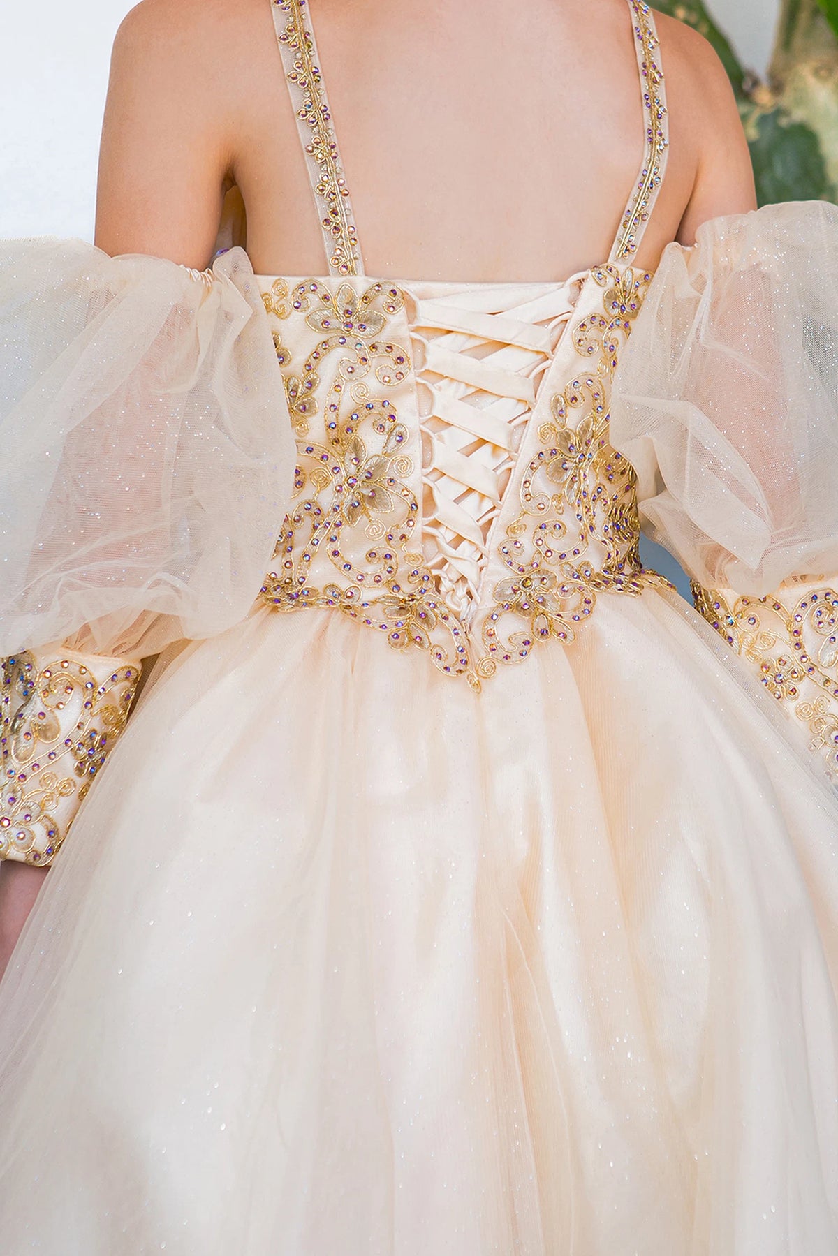 Detailed by floral lace across the back bodice, the Champagne kids party dress reveals its construction.