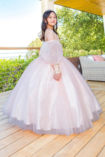 Side view of a kid wearing blush mini quince dress with glitter tulle detachable sheer puff sleeves