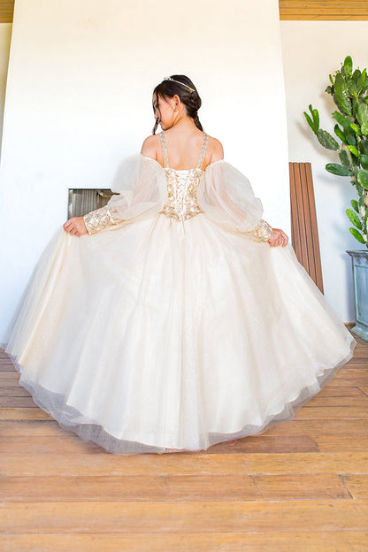 Kid wearing champagne mini quince dress with glitter tulle detachable sheer puff sleeves and back detail