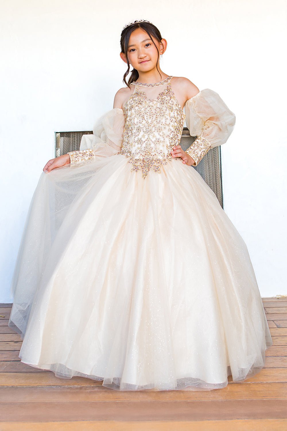 Front view of champagne mini quince dress with detachable sheer puff sleeves glitter tulle sleeve detail.