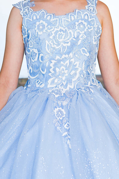 Kid wearing blue mini quince dress with sparkling fabric 3D flower puff print bodice detail