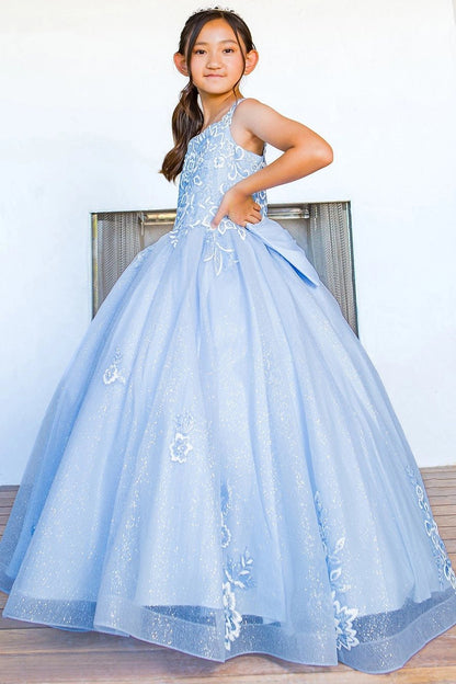 Displayed in a angled view, the Blue mini quince dress has floral lace appliques flowing onto the glitter tulle skirt.