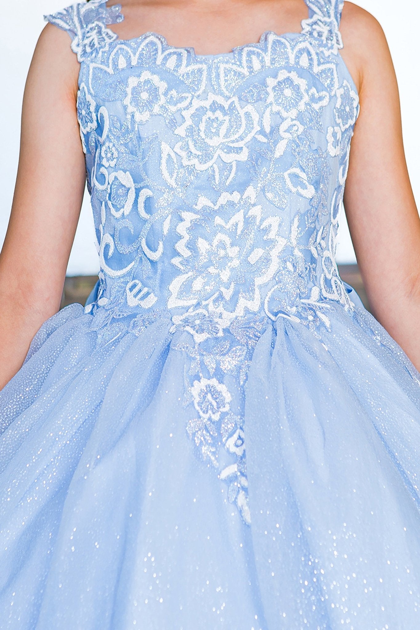 Blue mini quince dress with sparkling fabric 3D flower puff print bodice detail.