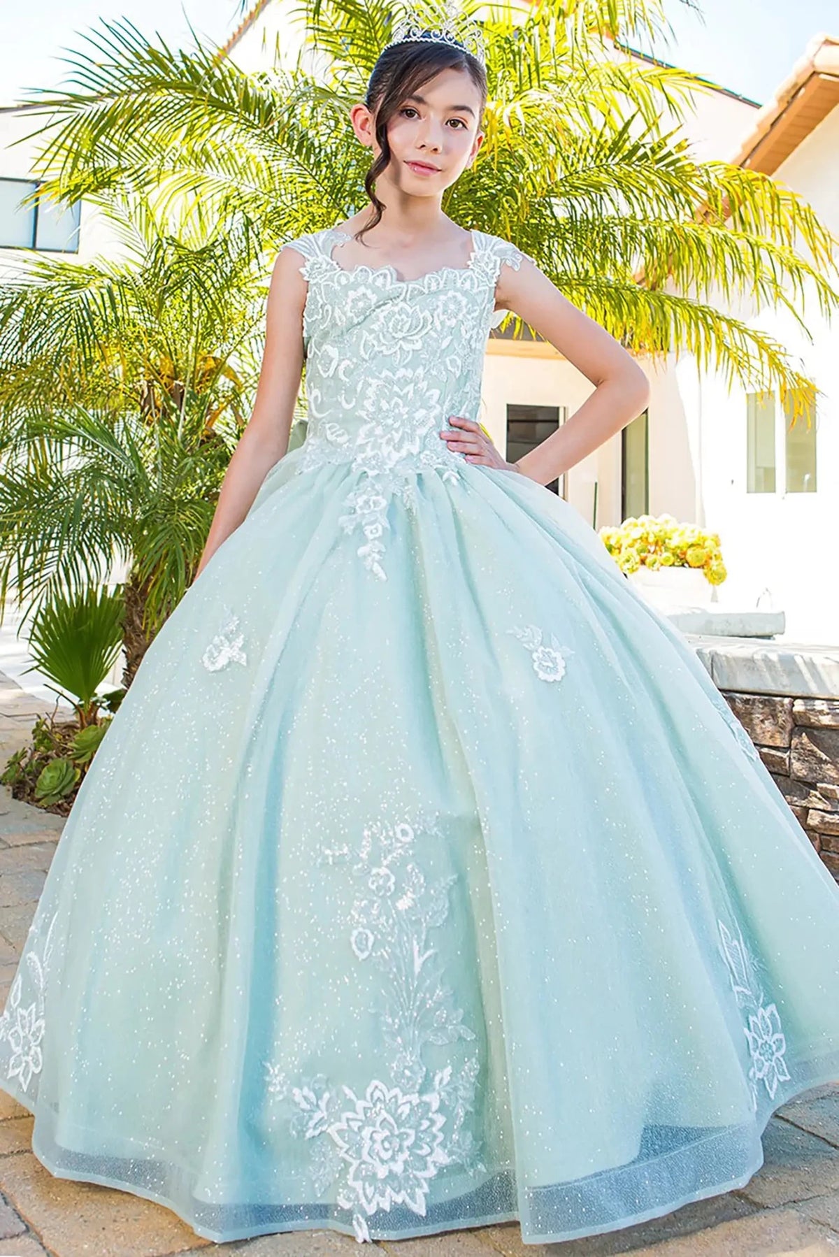Front view of sage mini quince dress with 3D sparkling fabric 3D flower puff print and A-line skirt.