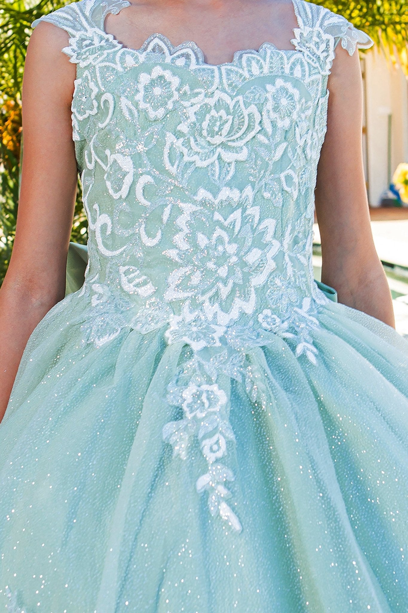 Sage mini quince dress with 3D sparkling fabric 3D flower puff print and side view.