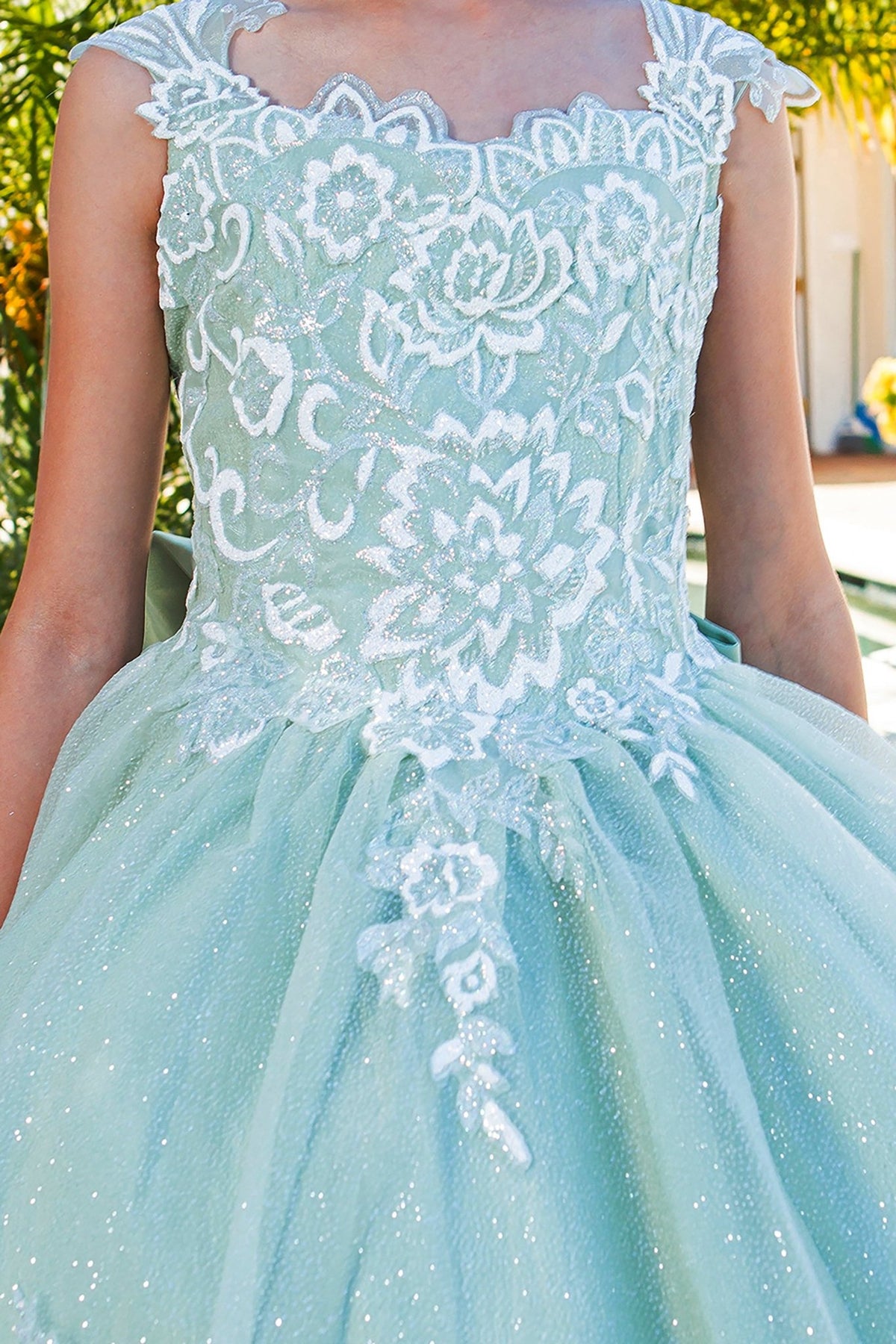 Sage mini quince dress with 3D sparkling fabric 3D flower puff print and side view.