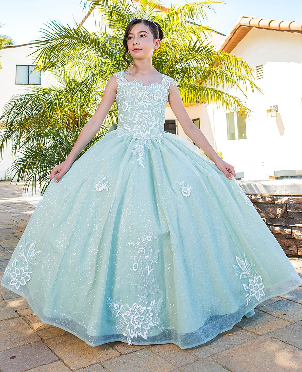 Close-up back view of sage mini quince dress with 3D sparkling fabric 3D flower puff print detachable ribbon
