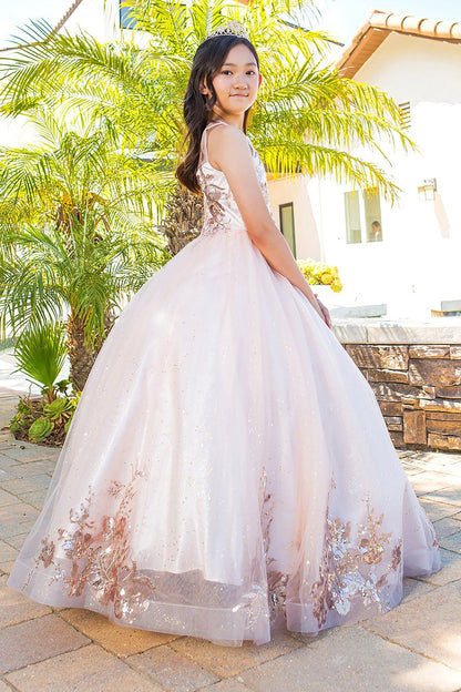 Kid wearing blush mini quince dress with glitter tulle layered skirt and side view