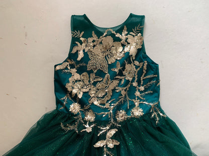 Kid wearing hunter green mini quince dress with glitter tulle bodice top zoom detail