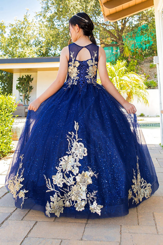 Kid wearing navy mini quince dress with glitter tulle layered skirt and back view