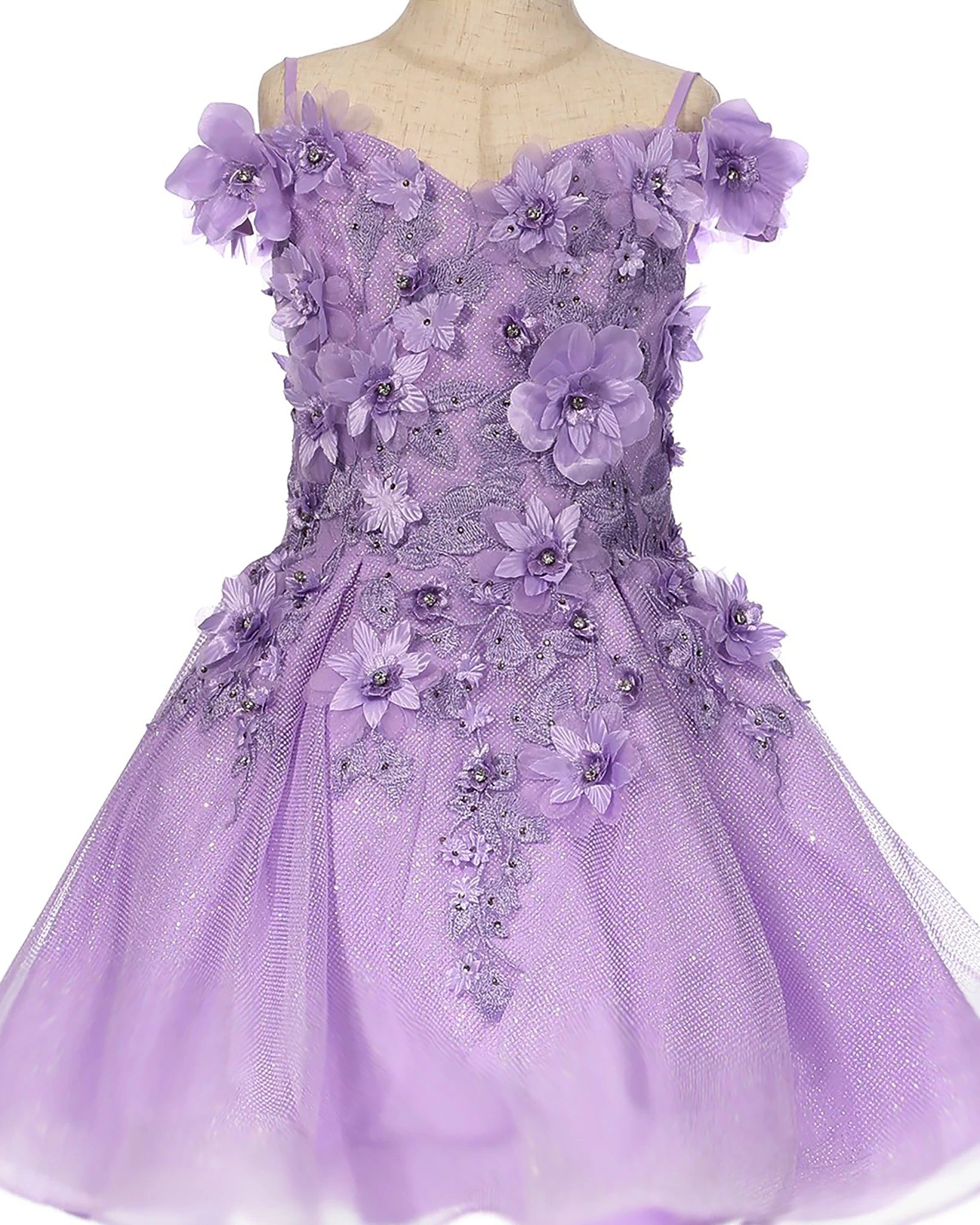 Lilac flower girl dress with floral embellishments.