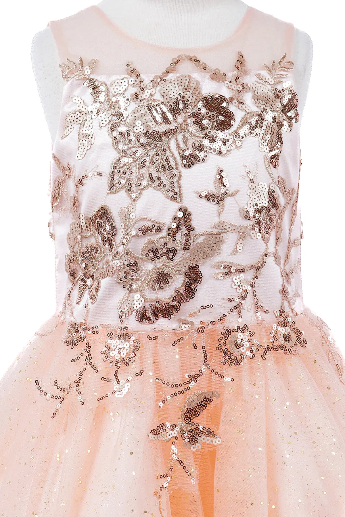 Trimmed by contrasting floral lace appliques, the Blush kids party dress reveals its construction.