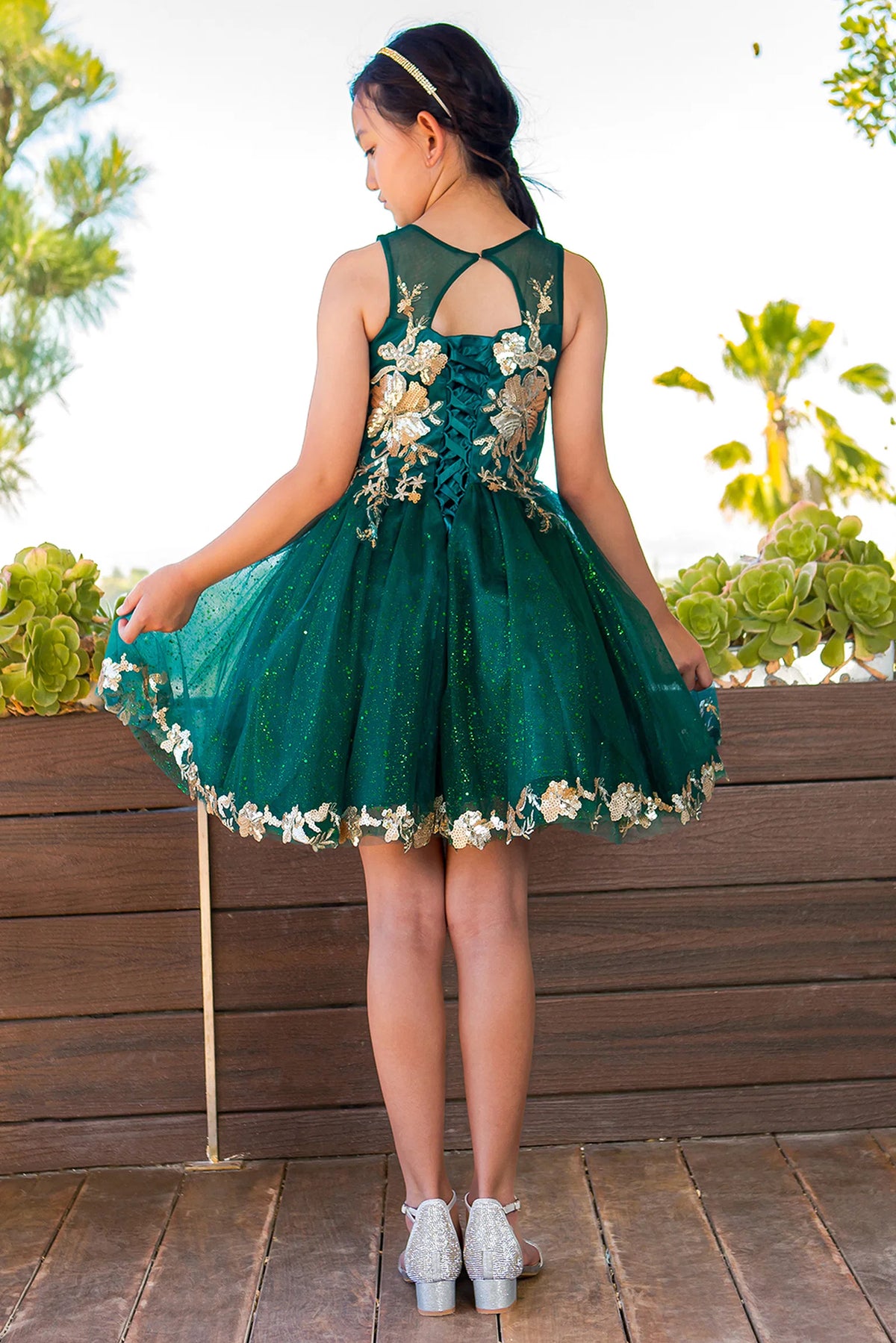 Defined gold lace appliques on the skirt adds character to this Hunter Green kids party dress.