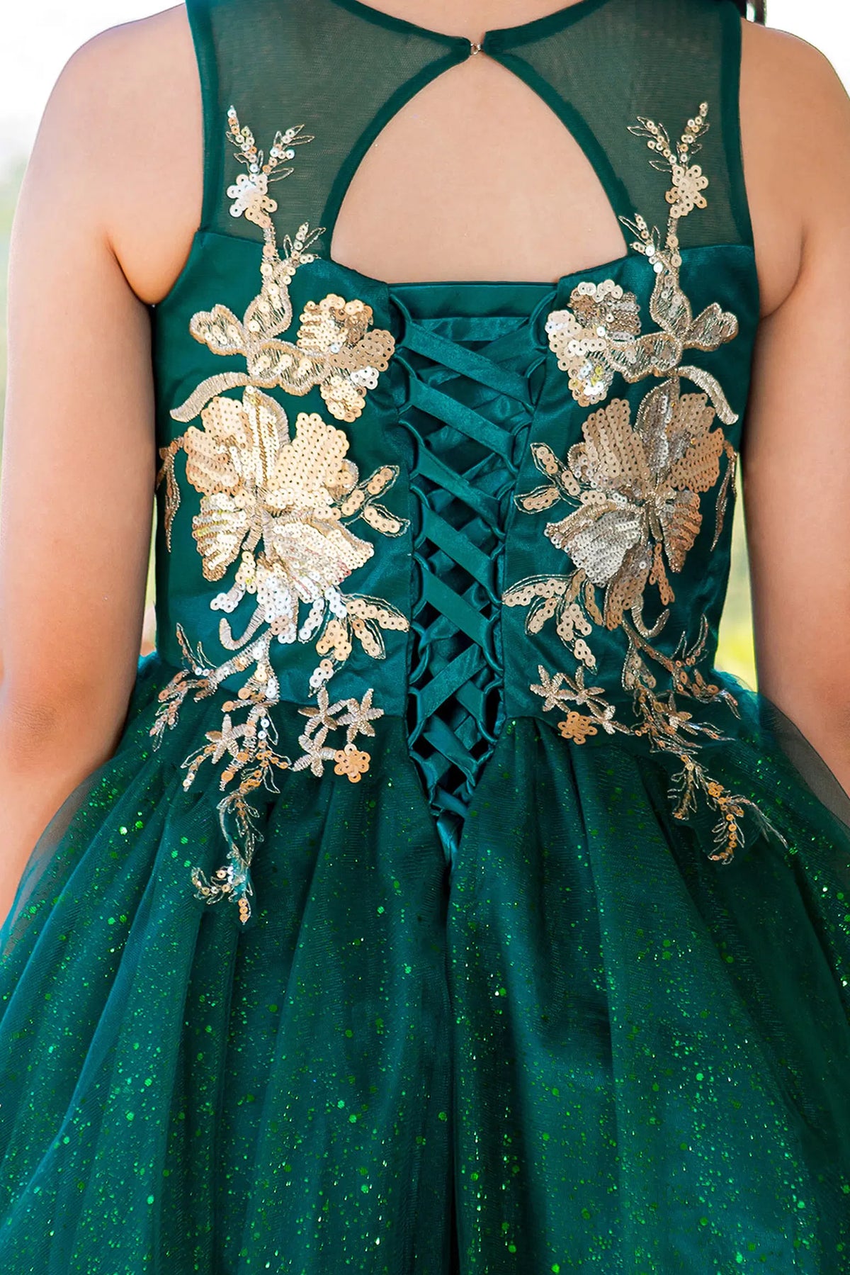 Featuring with gold lace appliques on the skirt, this Hunter Green kids party dress displays elegant detail.
