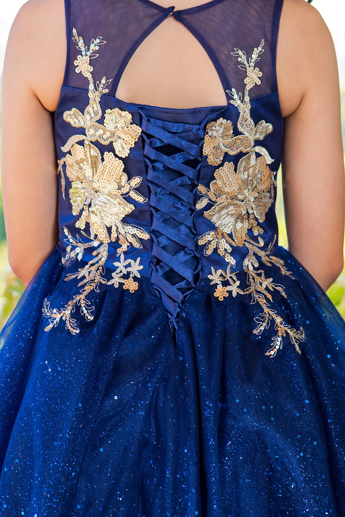 Accented a lace-decorated back bodice adds character to this Navy kids party dress.