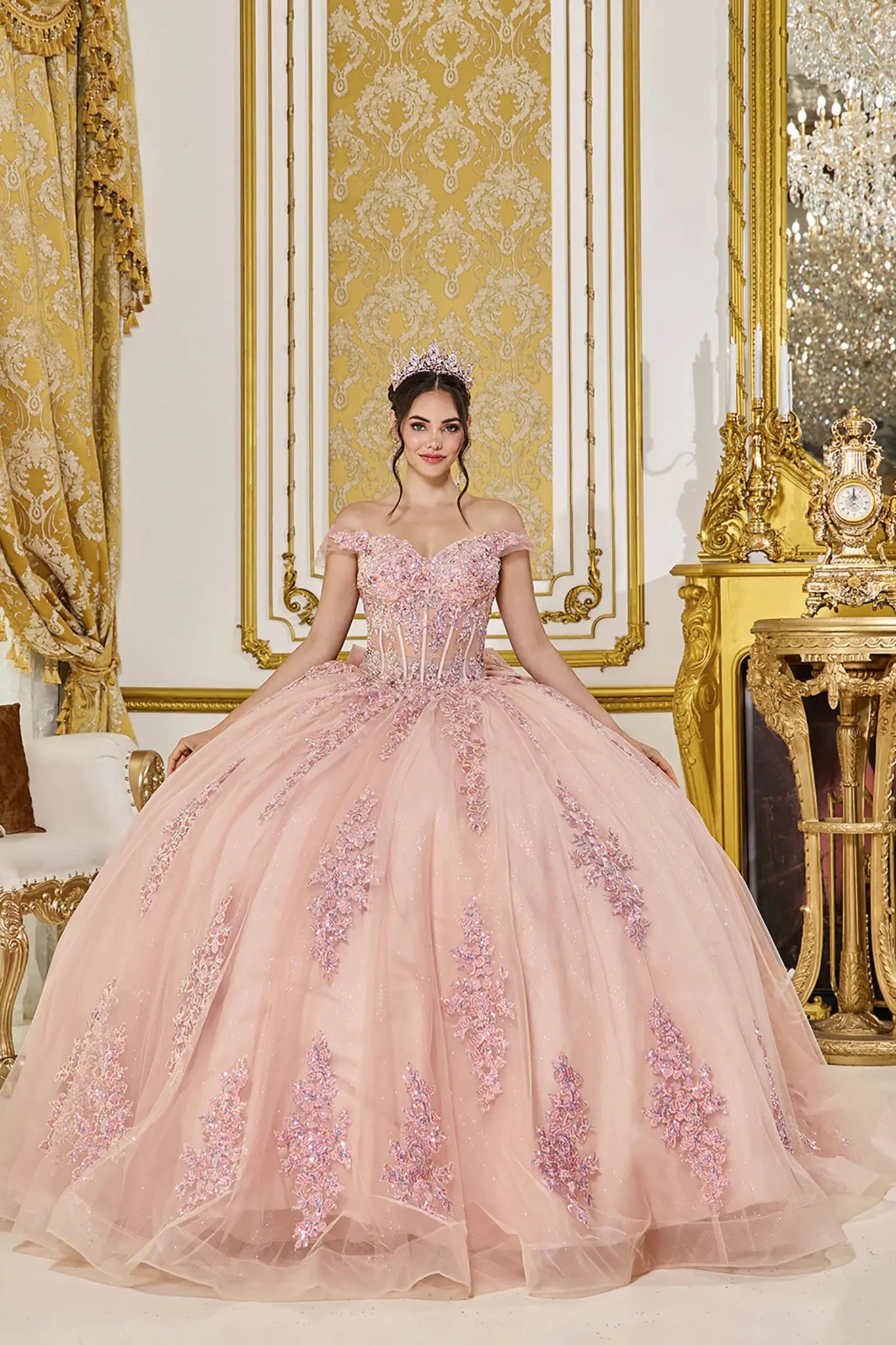 Front view of rose gold quinceañera ball gown with off-the-shoulder sweetheart corset bodice, crystal embellishments, and full glitter tulle skirt with lace appliques