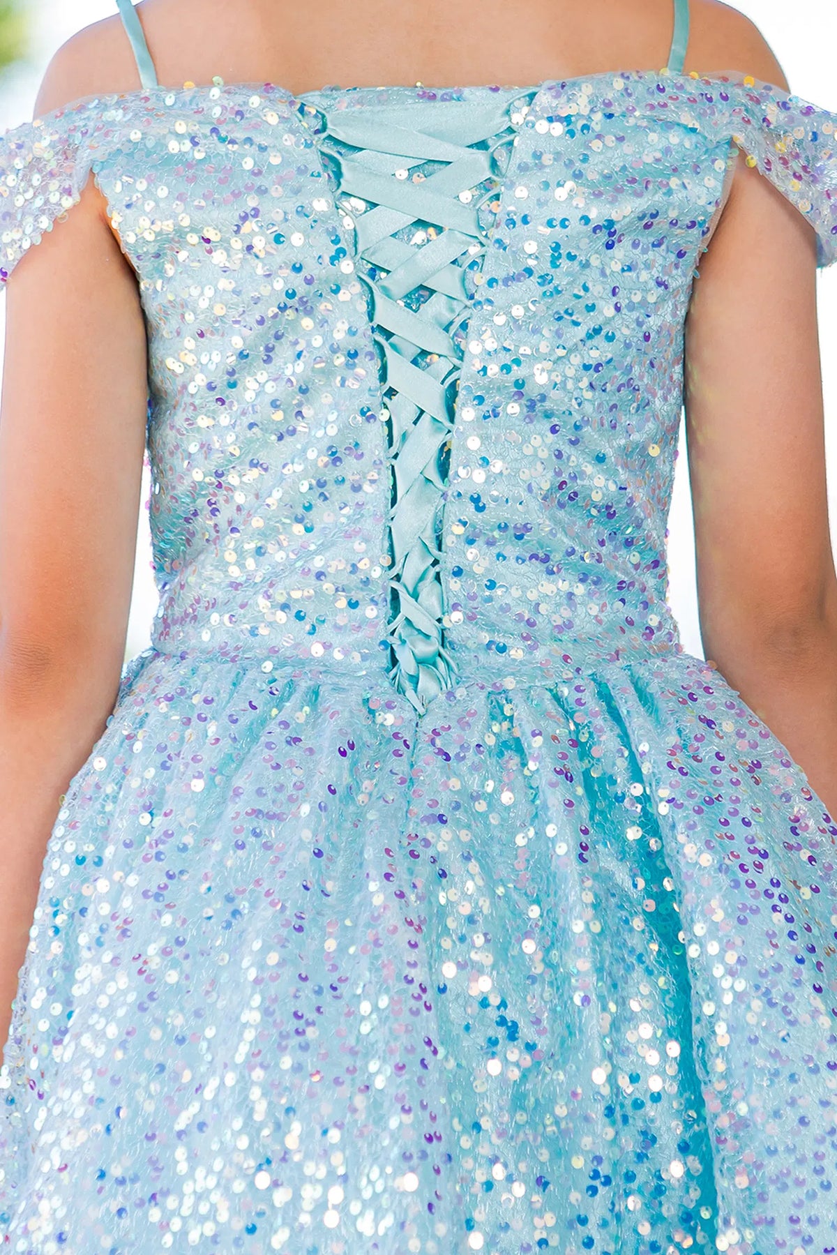 Detailed by crisscross back lacing, the Blue kids party dress reveals its construction.