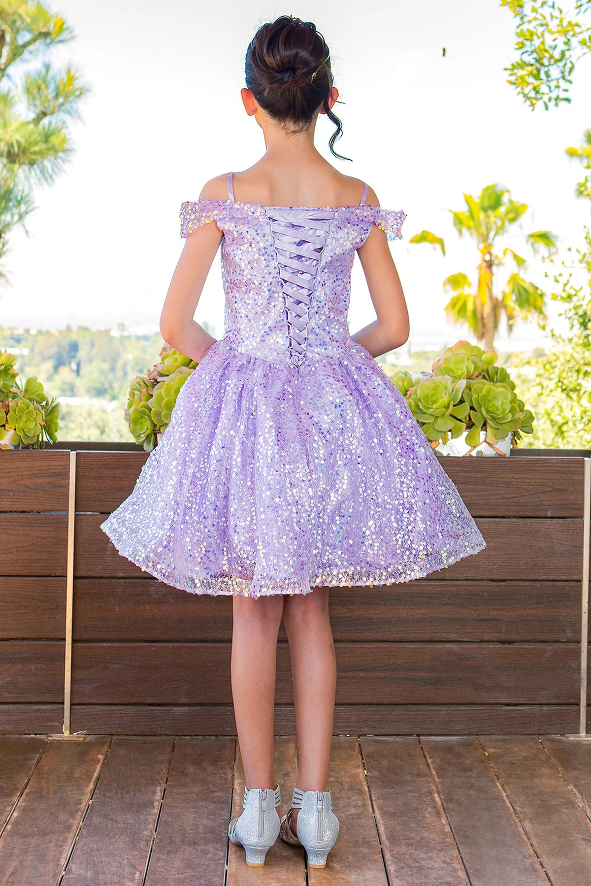 Finished details of crisscross back lacing distinguish the Lilac kids party dress.