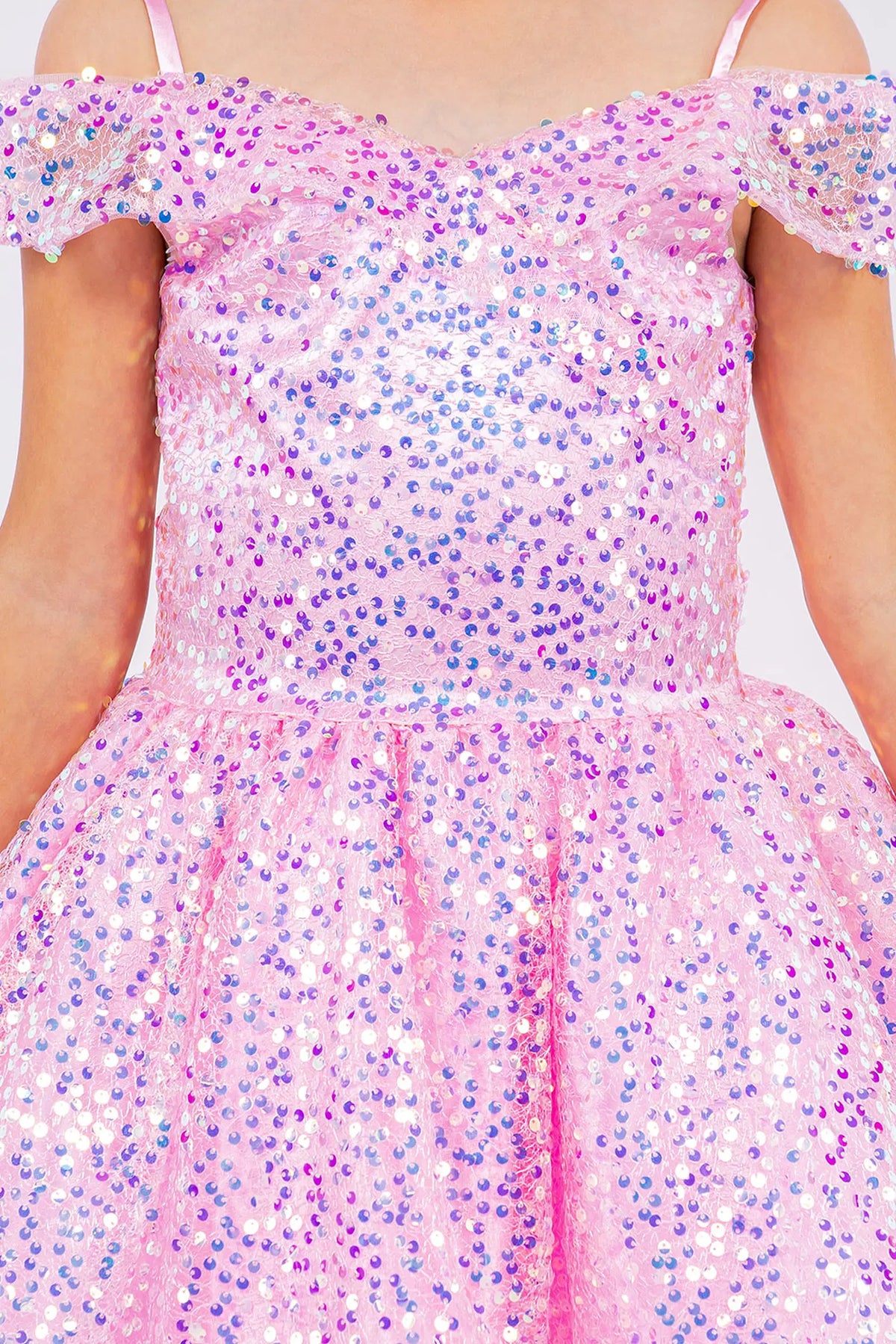 Trimmed by shimmering sequins throughout the dress, the Pink kids party dress reveals its construction.