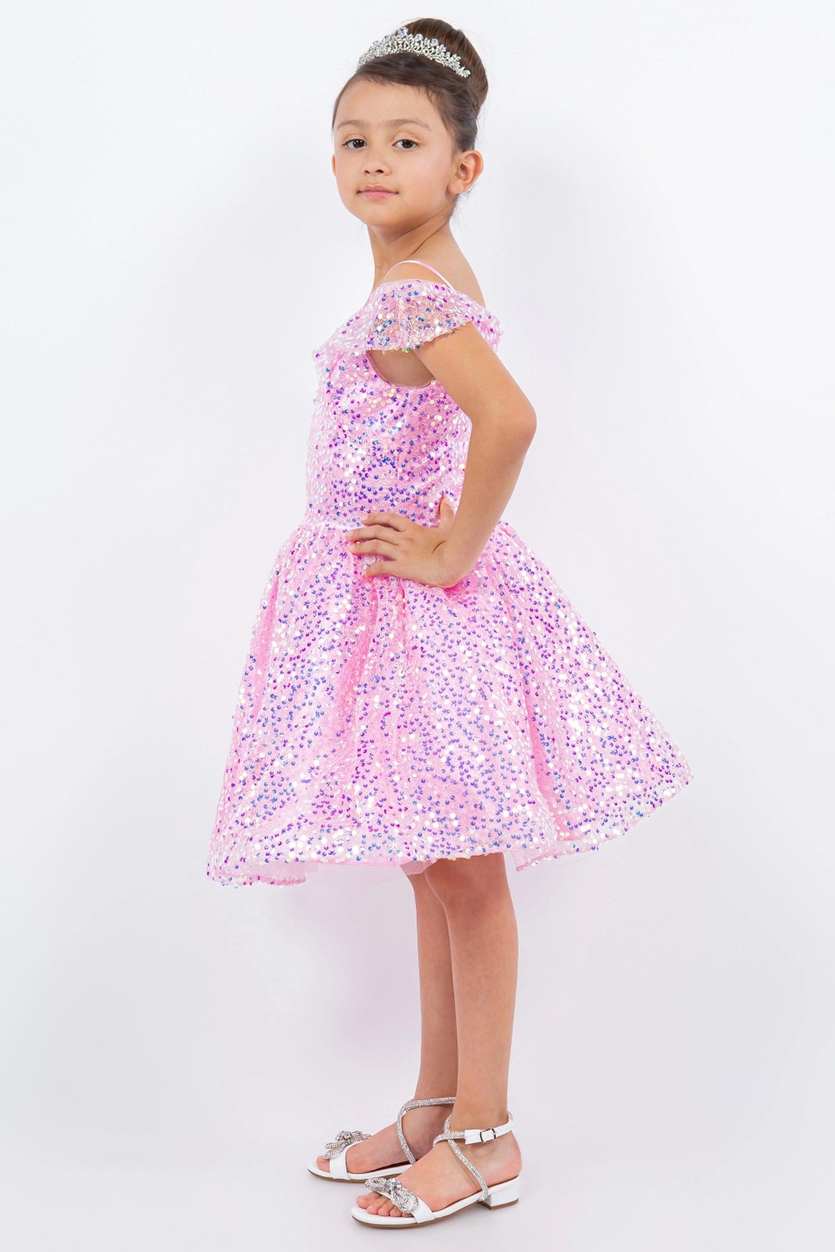 Decorated details of shimmering sequins throughout the dress distinguish the Pink kids party dress.