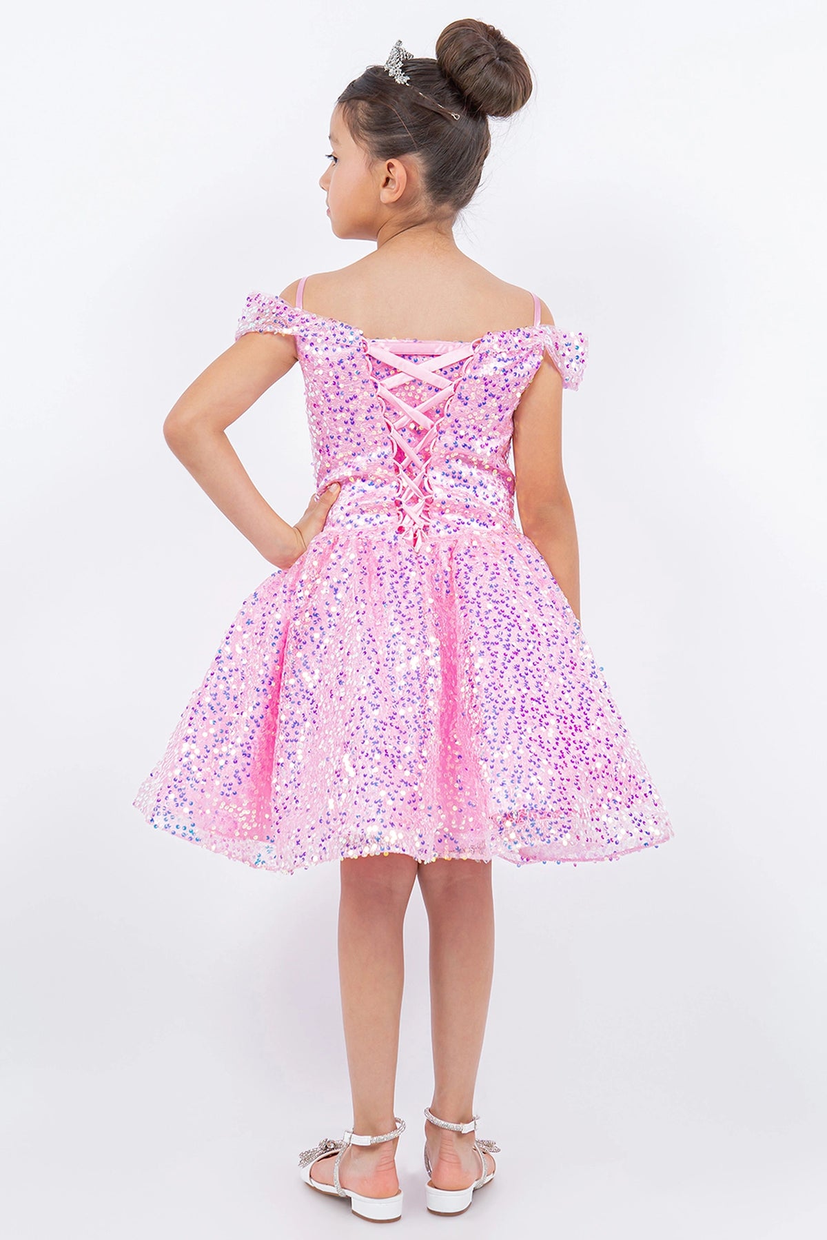 Detailed by crisscross back lacing, the Pink kids party dress reveals its construction.