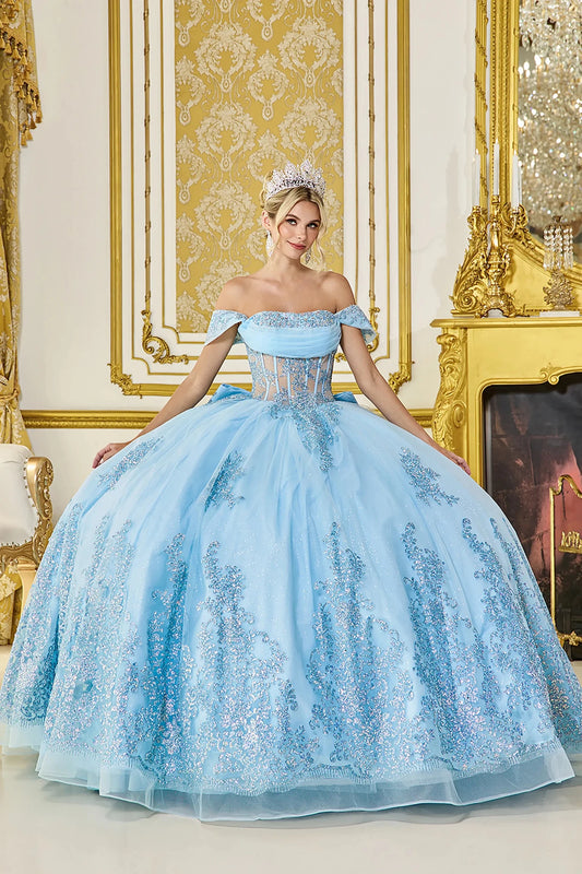 Woman in Bahama blue off-shoulder quinceañera ball gown with sequin corset and glitter tulle skirt.