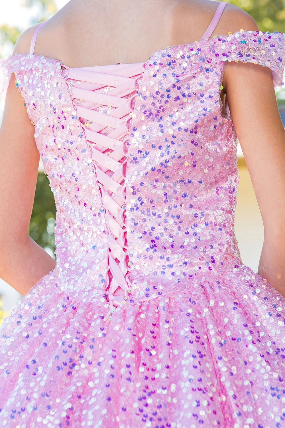 Displayed in a back detail, the Pink mini quince dress has lace-up closure and sequin-covered bodice.
